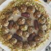 Dates and nuts ladoo recipe made with dates, almonds, walnuts, pistachios, and cashews arranged on a serving plate