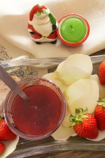 Homemade strawberry jam recipe made with fresh strawberries served in a glass jar with toast