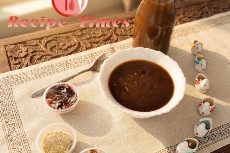 Homemade tamarind chutney recipe made with dates, jaggery, and Indian spices served in a bowl