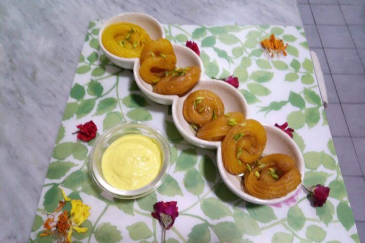 Crispy homemade Jalebi Recipe soaked in saffron sugar syrup and served with rabri