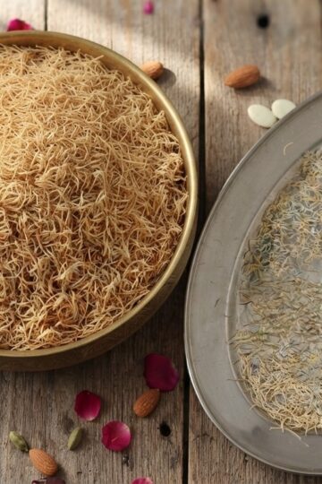 Homemade jawe seviyan vermicelli strands drying on a tray