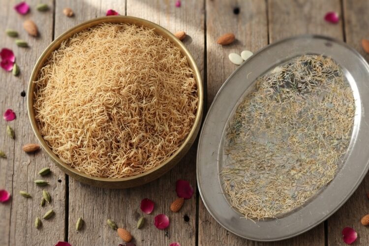 Homemade jawe seviyan vermicelli strands drying on a tray