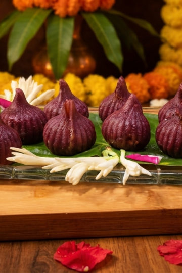 Hibiscus Ukadiche Modak made with natural hibiscus-infused rice flour and coconut jaggery filling