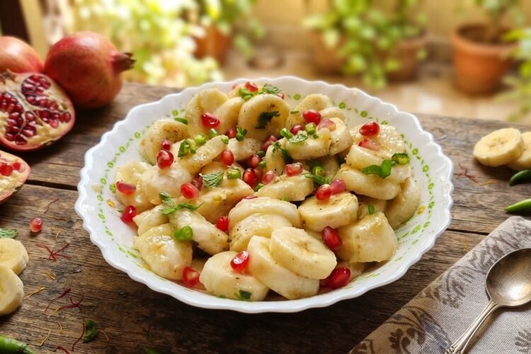 Banana pomegranate salad with green chilli and lemon juice